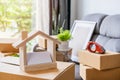Stack of cardboard boxes in living room at new house Royalty Free Stock Photo