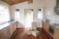 Stack of cardboard boxes in new modern kitchen