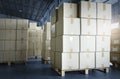 Stack of cardboard boxes on pallet rack in warehouse storage. Shipment. Cargo import and export. Manufacturing warehouse. Royalty Free Stock Photo