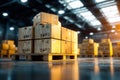 Stack of cardboard boxes on wooden pallets in a modern warehouse setting during daytime Royalty Free Stock Photo