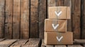 Stack of cardboard parcels with checkmarks on rustic wooden background, delivery and packaging concept Royalty Free Stock Photo