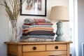 stack of cardigans on hallway console table Royalty Free Stock Photo