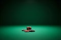 Stack of casino poker chips on a green felt table surface Royalty Free Stock Photo
