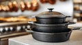 Stack of cast iron cookware in a kitchen setting. Royalty Free Stock Photo