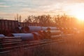 Stack of cast iron pipes in loading area waiting for transportation Royalty Free Stock Photo