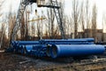 Stack of cast iron pipes in loading area waiting for transportation Royalty Free Stock Photo