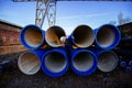 Stack of cast iron pipes in loading area waiting for transportation Royalty Free Stock Photo