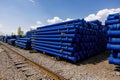 Stack of cast iron pipes in loading area waiting for transportation Royalty Free Stock Photo