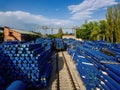 Stack of cast iron pipes in loading area waiting for transportation, drone aerial view Royalty Free Stock Photo
