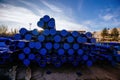 Stack of cast iron pipes in loading area waiting for transportation Royalty Free Stock Photo