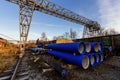 Stack of cast iron pipes in loading area waiting for transportation Royalty Free Stock Photo