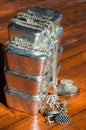 A stack of cast silver bars, coins and jewelry