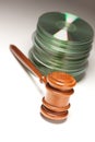 Stack of CD Rom or DVD Discs and Gavel Royalty Free Stock Photo