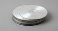 Stack of CDs and DVDs on a Gray Background Royalty Free Stock Photo