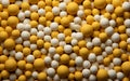A Stack of Ceramic Beads in Shades of Yellow and Tan.ai