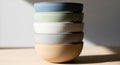 Stack of ceramic bowls in soft colors: blue, green, white, gray, and beige. Smooth texture with Royalty Free Stock Photo