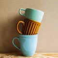 Stack of ceramic mug cups on wooden table Royalty Free Stock Photo