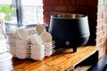 Stack of Ceramics White Cups Set in Neat and Tidy on Vintage Wooden Table in a Restaurant or Cafe