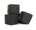 Stack of charcoal cubes for hookah on white background