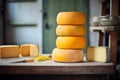 a stack of cheese wheels in a cellar Royalty Free Stock Photo