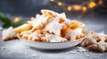 Stack of Chiacchiere powdered with sugar, a homemade carnival sweets over bokeh background. Homestyle chiacchiere in a plate on a