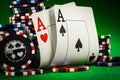 Stack of chips and two aces on the table on the green baize Royalty Free Stock Photo