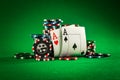 Stack of chips and two aces on the table on the green baize Royalty Free Stock Photo