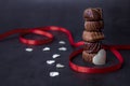Stack of Chocolate candy and red ribbon
