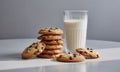 Stack of Chocolate Chip Cookies with Glass of Milk on White Marble Surface in Natural Light Royalty Free Stock Photo