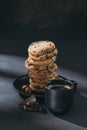stack of chocolate-chip cookies on plate with cup of coffee Royalty Free Stock Photo