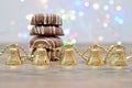 A stack of chocolate covered biscuits and a row of christmas tree decorations Royalty Free Stock Photo