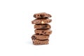 Stack of chocolate pieces with raisins and peanuts, isolated on white background Royalty Free Stock Photo