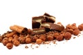 Stack of chocolate tiles with hazelnuts and cinnamon sticks. Royalty Free Stock Photo