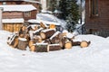 Stack of chopped fire woods on a snow