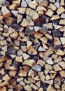 Stack of chopped firewood. Vertical background