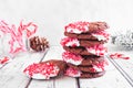 Stack of Christmas chocolate candy cane cookies. Table scene with a white background. Royalty Free Stock Photo