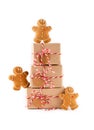 Stack of Christmas gifts boxes in craft paper.with crunchy gingerbread men cookies. Merry Christmas concept Royalty Free Stock Photo