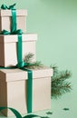 Stack of christmas gifts on green background Royalty Free Stock Photo