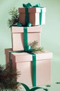Stack of christmas gifts on green background Royalty Free Stock Photo