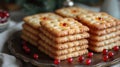 Stack of Christmas shortbread cookies with berry decoration on vintage plate