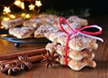 Stack of Christmas tree shaped cinnamon biscuits with spices on wooden table Royalty Free Stock Photo