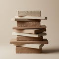 A stack of clay bricks in neutral tones of beige and light brown against a plain Royalty Free Stock Photo