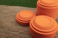 Stack of Clay disc flying targets on wooden table background ,Clay Pigeon target game Royalty Free Stock Photo