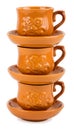 Stack of clay teacups with saucers Royalty Free Stock Photo
