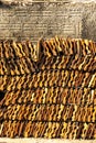 Stack of clay tile It arranged vertically with wall background