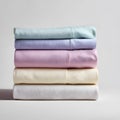 Stack of Clean Bedding Sheets and Towels Isolated on White Background for Home, Laundry, and Linen Concept Royalty Free Stock Photo