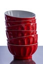 Stack of bright red ramekins on a kitchen table Royalty Free Stock Photo