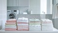 stack of clean clothes in the background washing machine Royalty Free Stock Photo