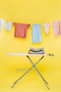 stack of clean clothes on ironing Royalty Free Stock Photo