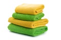 Stack of clean coloful soft towels on white background